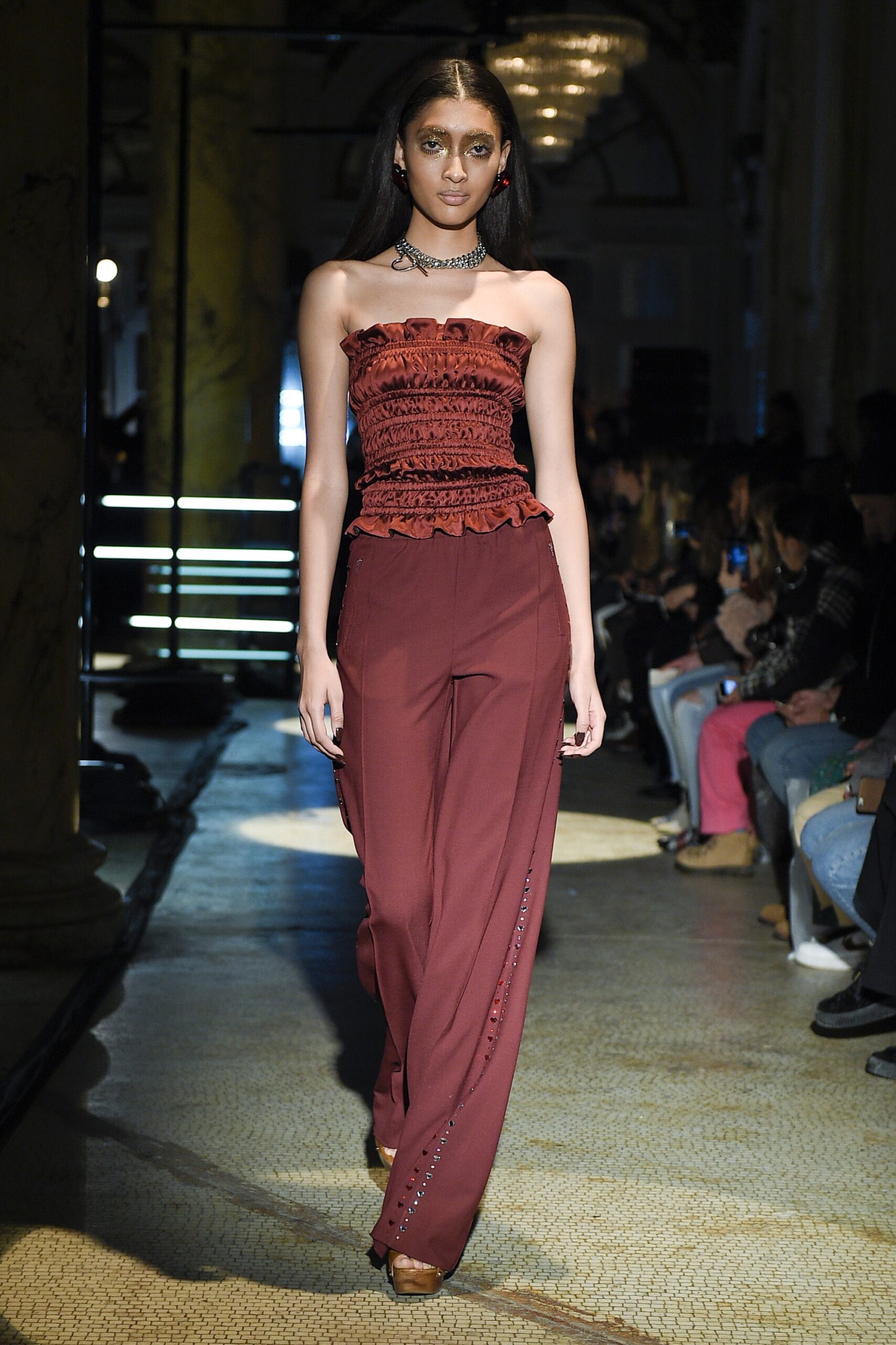 red strapless top with relaxed pants