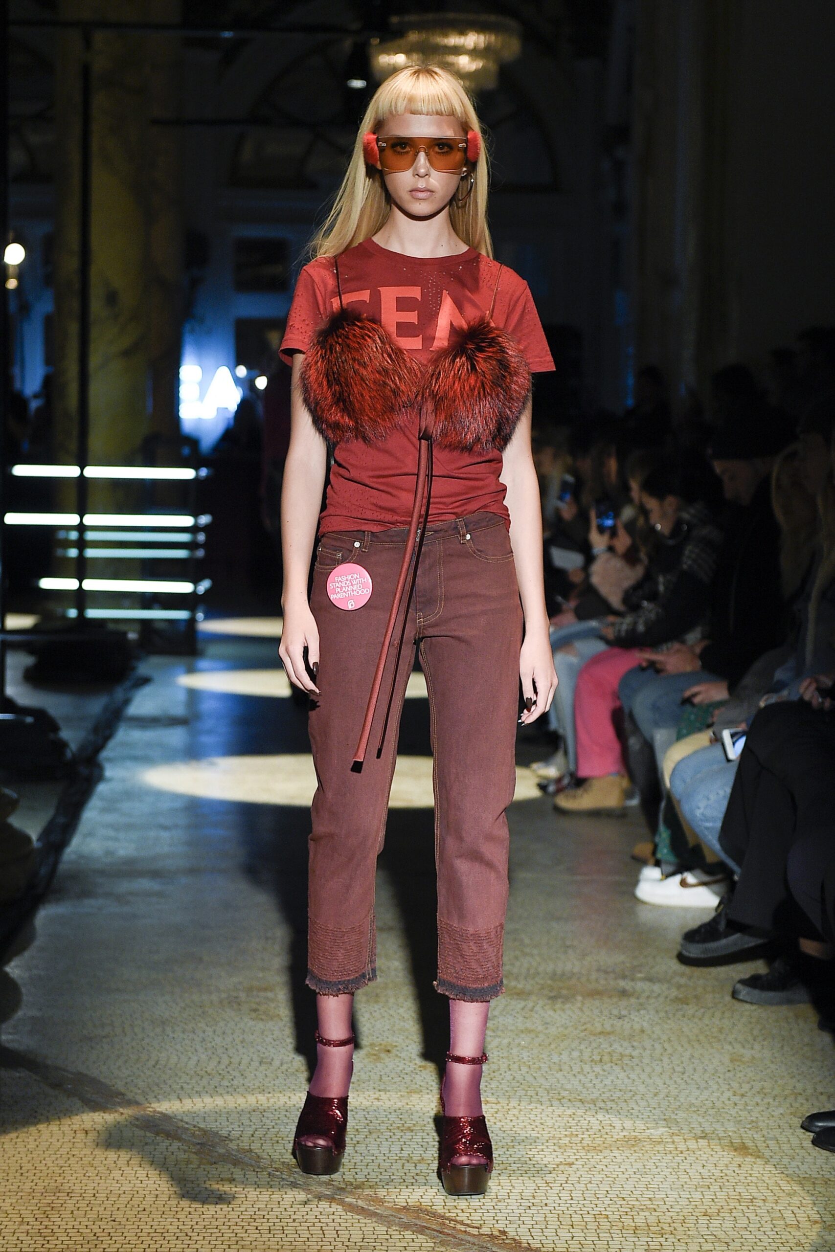 red fitted t-shirt with brown pants