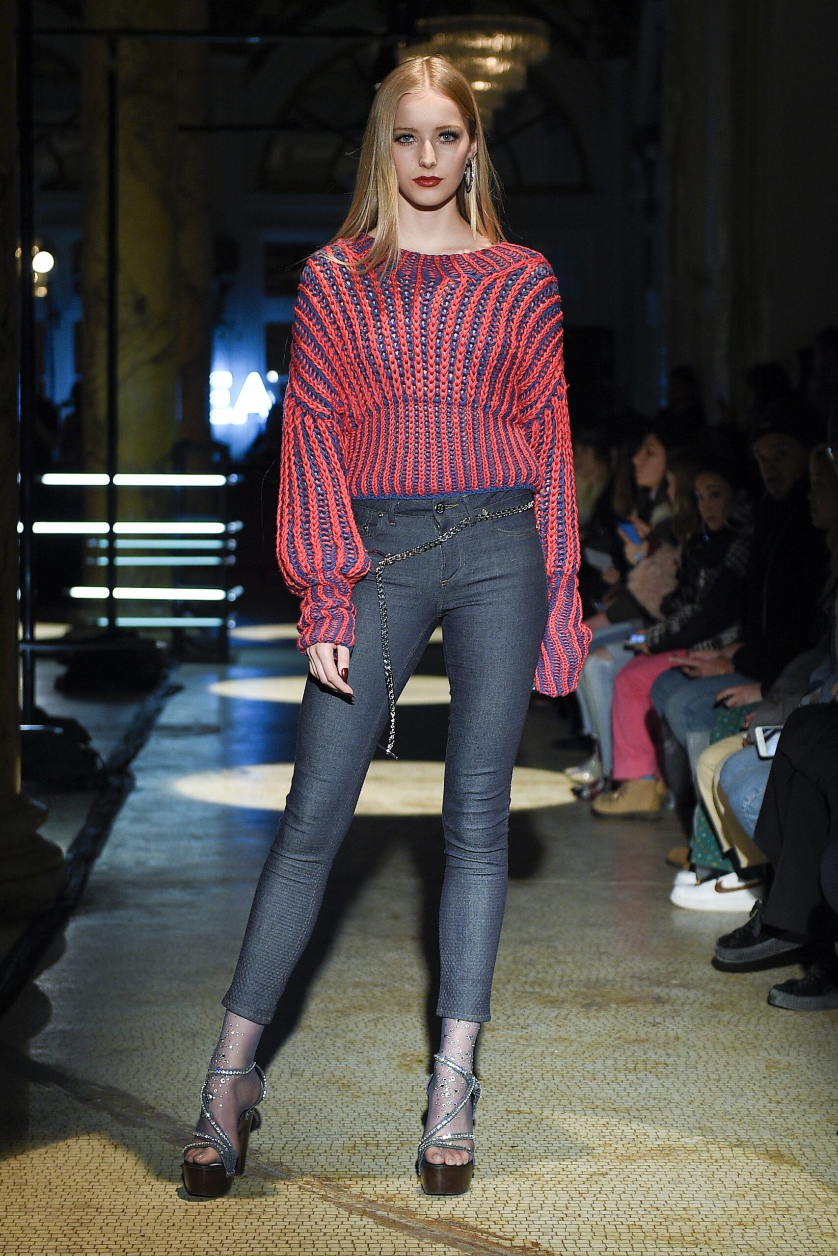 relaxed red pink sweater with fitted jeans