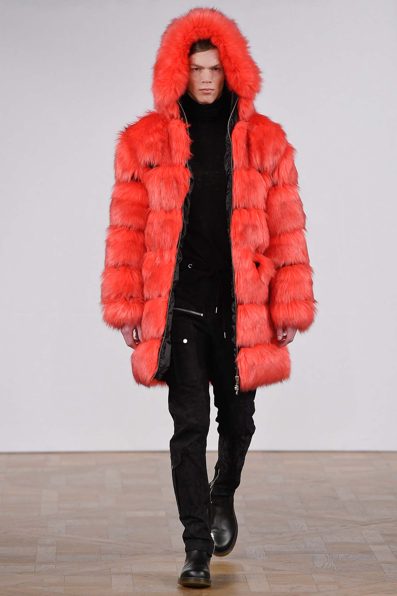 red faux-fur coat with black turtleneck