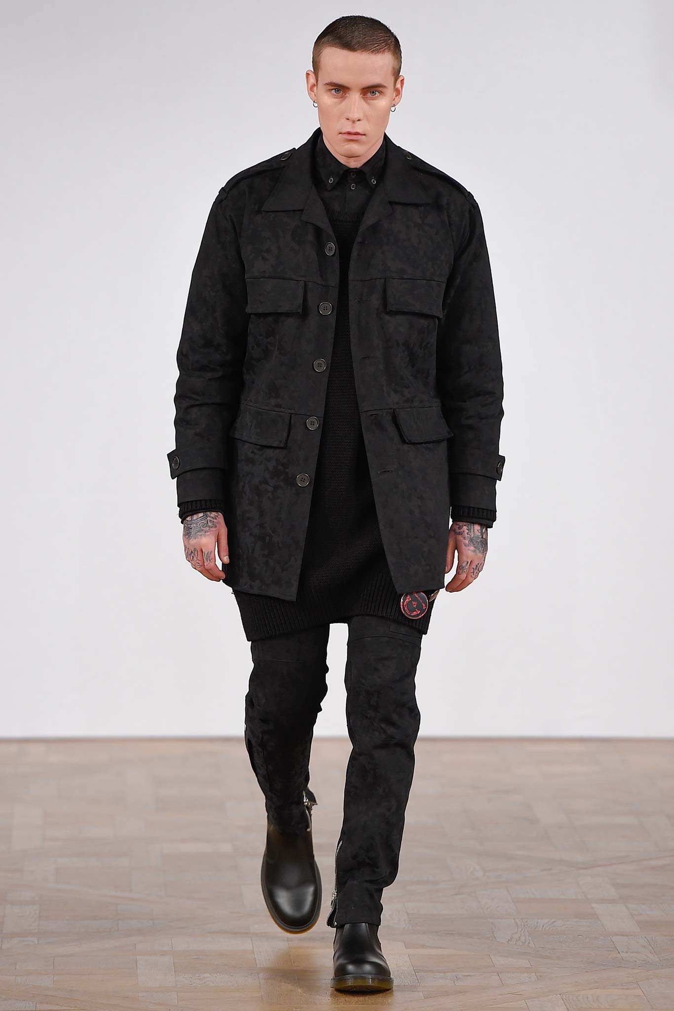 black relaxed coat with fitted sweater