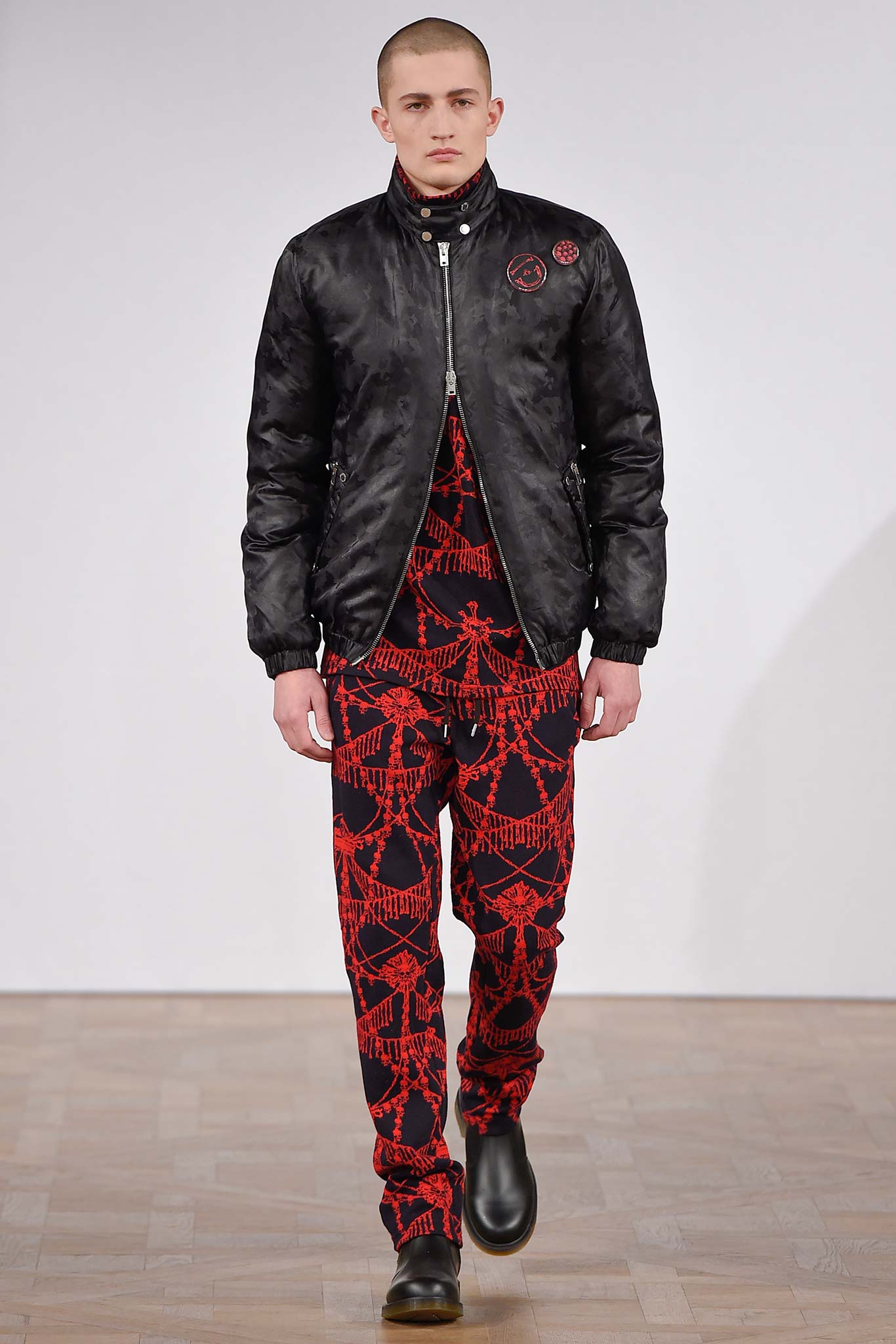 black fitted jacket with red printed pants