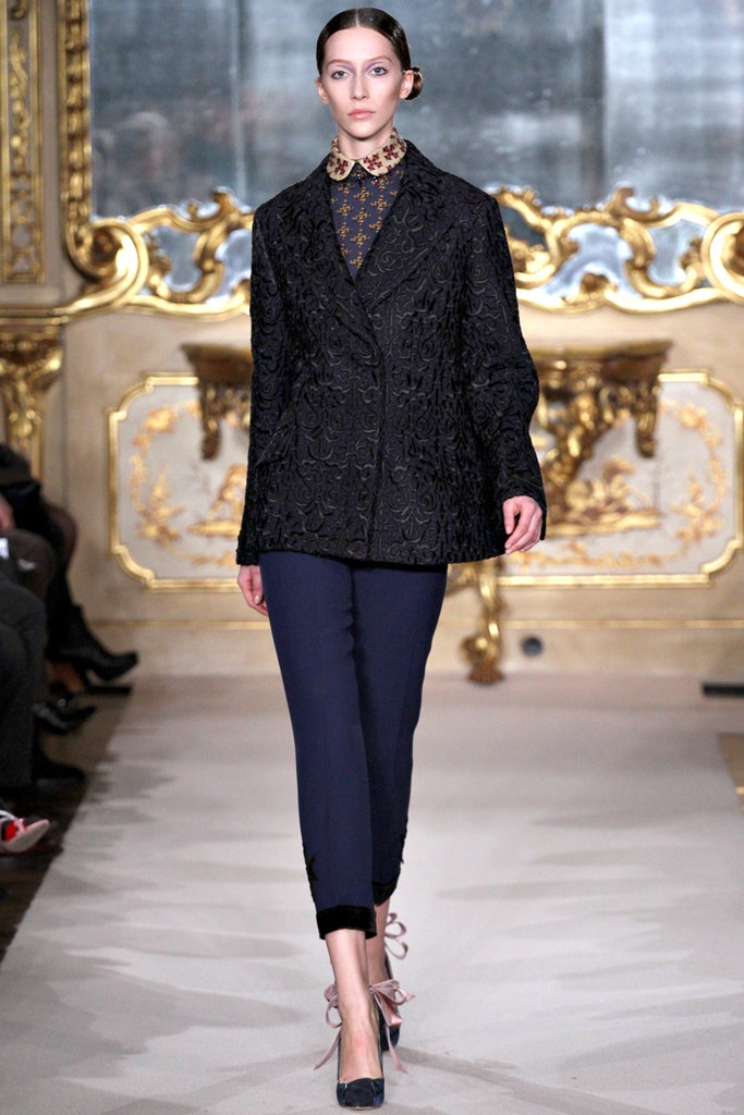 black embroidered blazer with blue pants