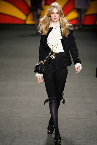black blazer white ruffled blouse