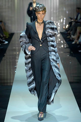 tailored black striped suit with fur coat