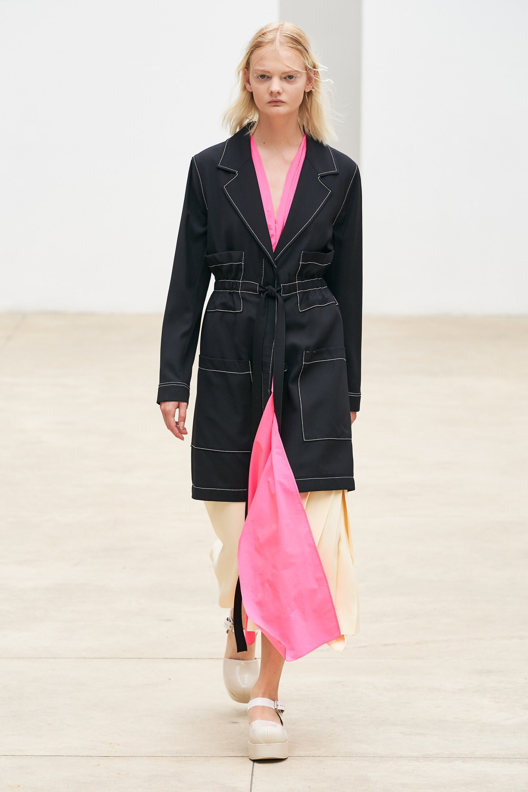 black coat with pink layered dress