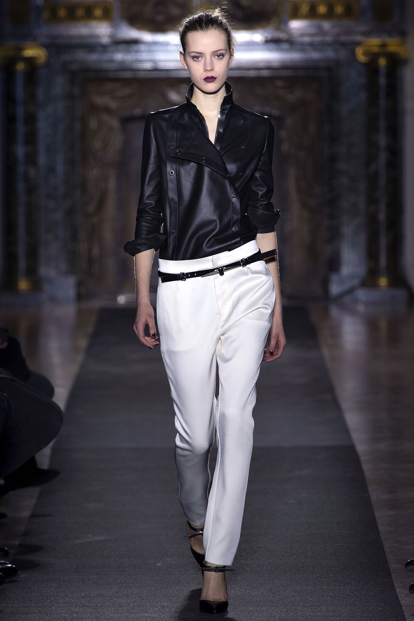 black leather fitted jacket and white tailored pants