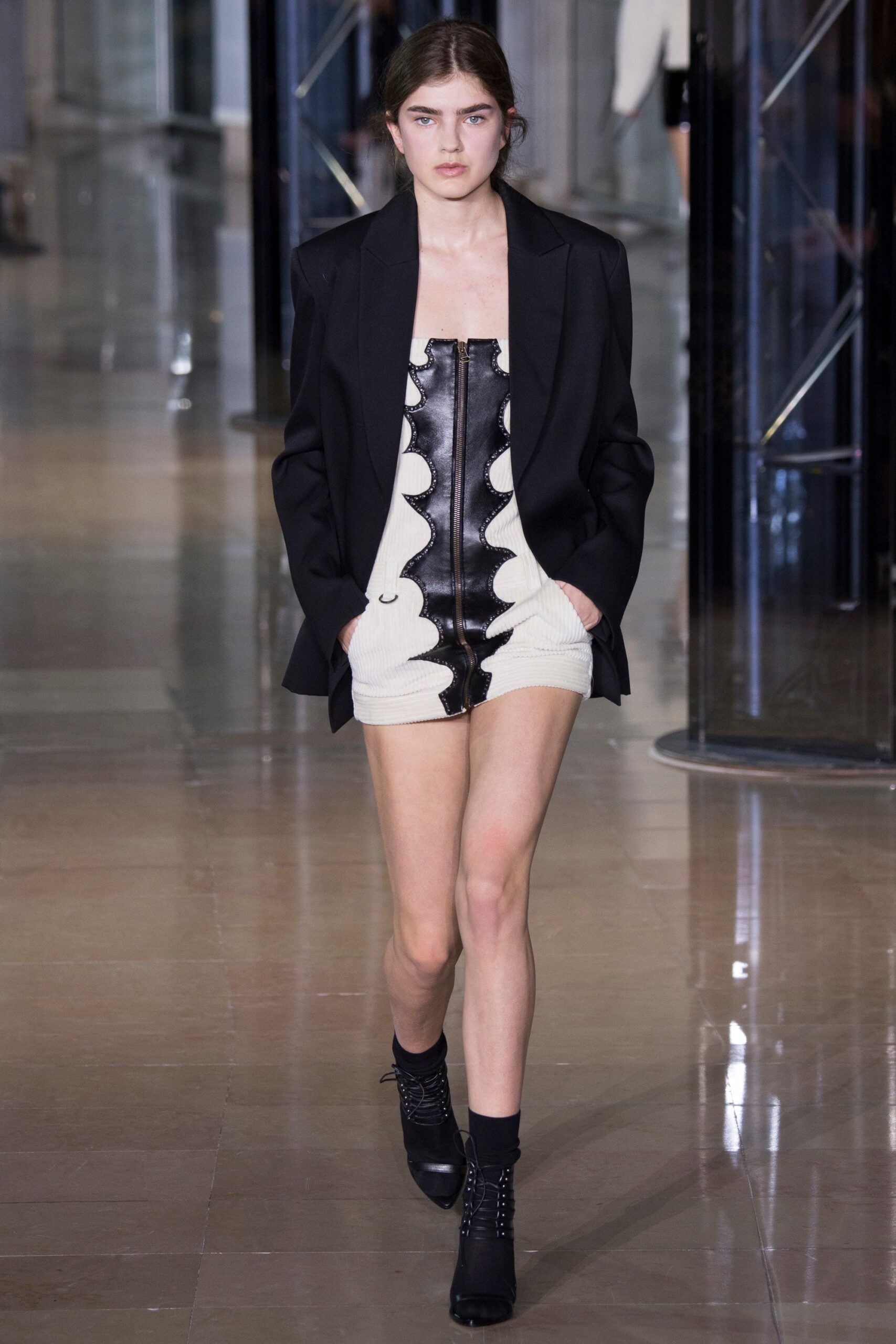 black tailored blazer and ruffled mini dress