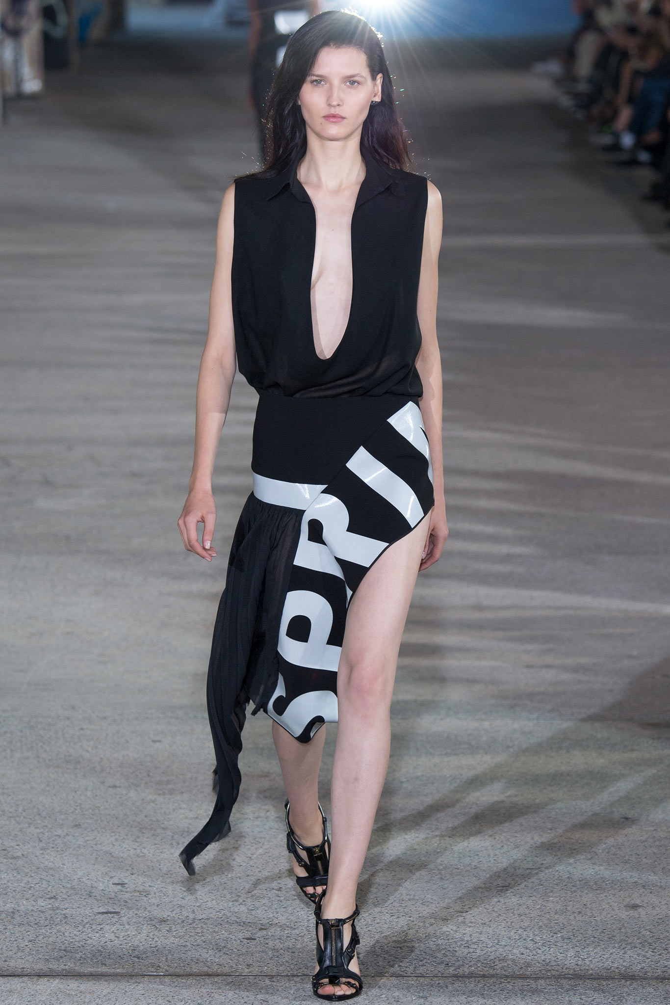 black fitted top and asymmetric skirt