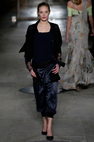black silk fitted top and blue relaxed pants