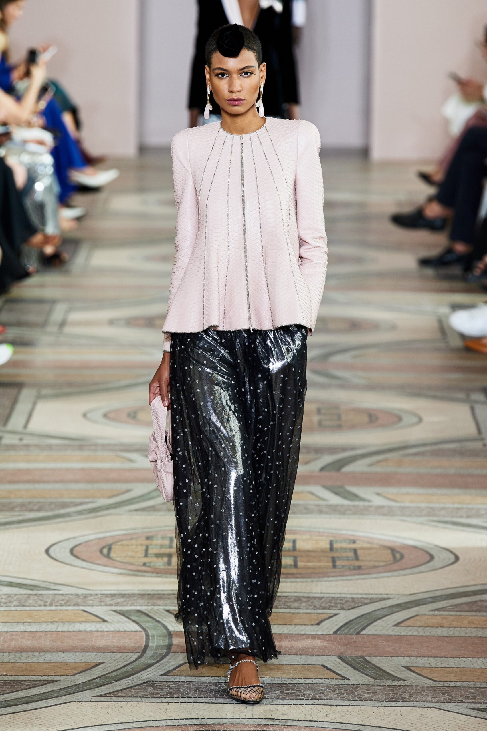 pink silk pleated blouse and black sequined pants