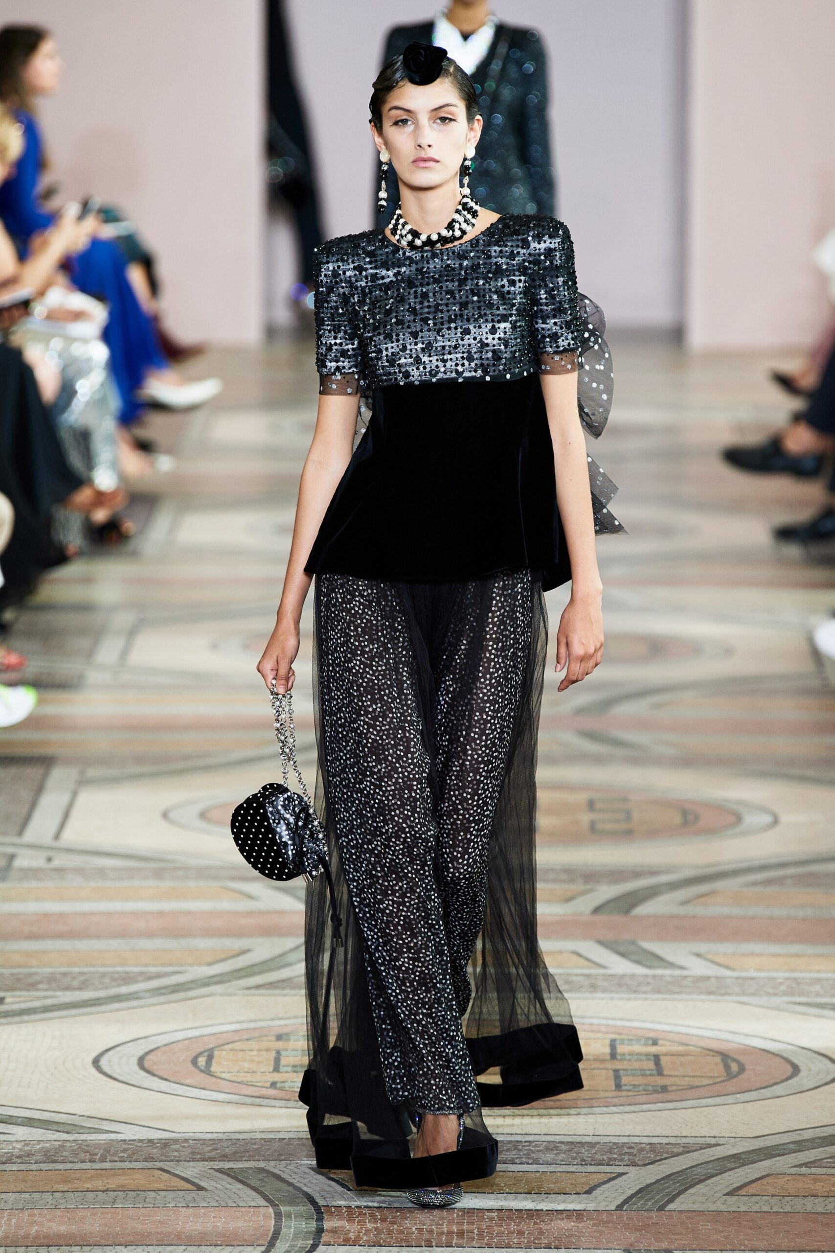 black and silver sequined top with wide-leg pants
