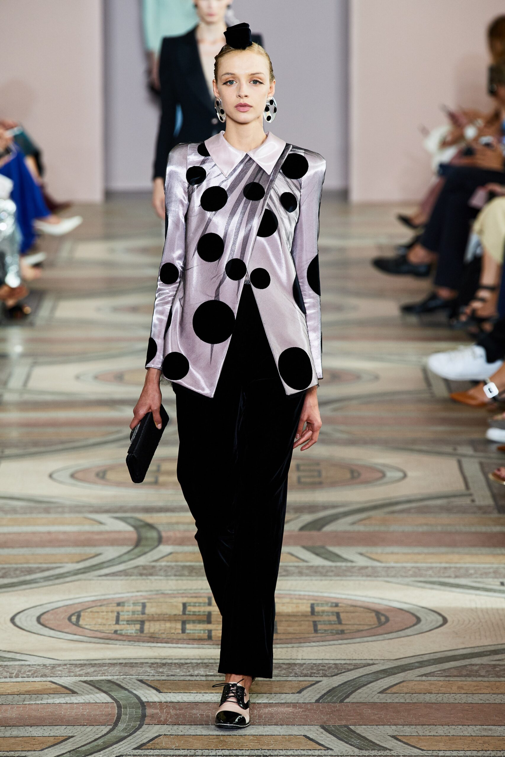 pink polka-dot blazer with black pants