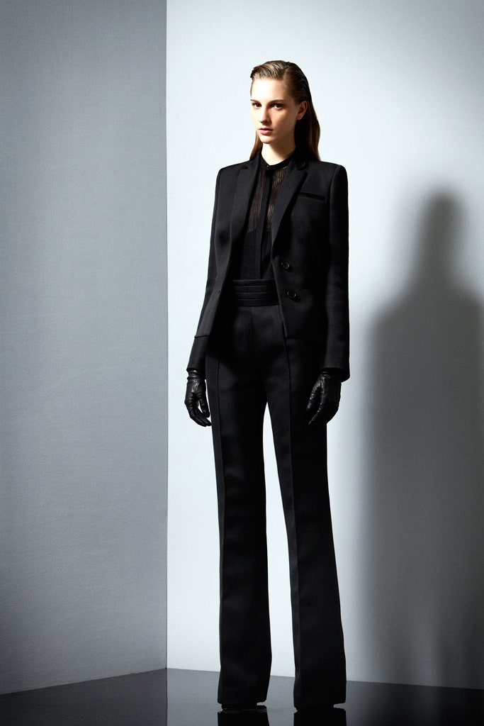 black tailored suit with sheer blouse