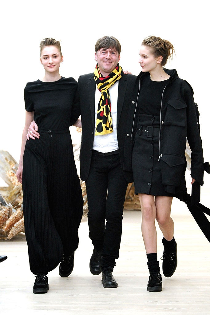 black fitted top and pleated skirt