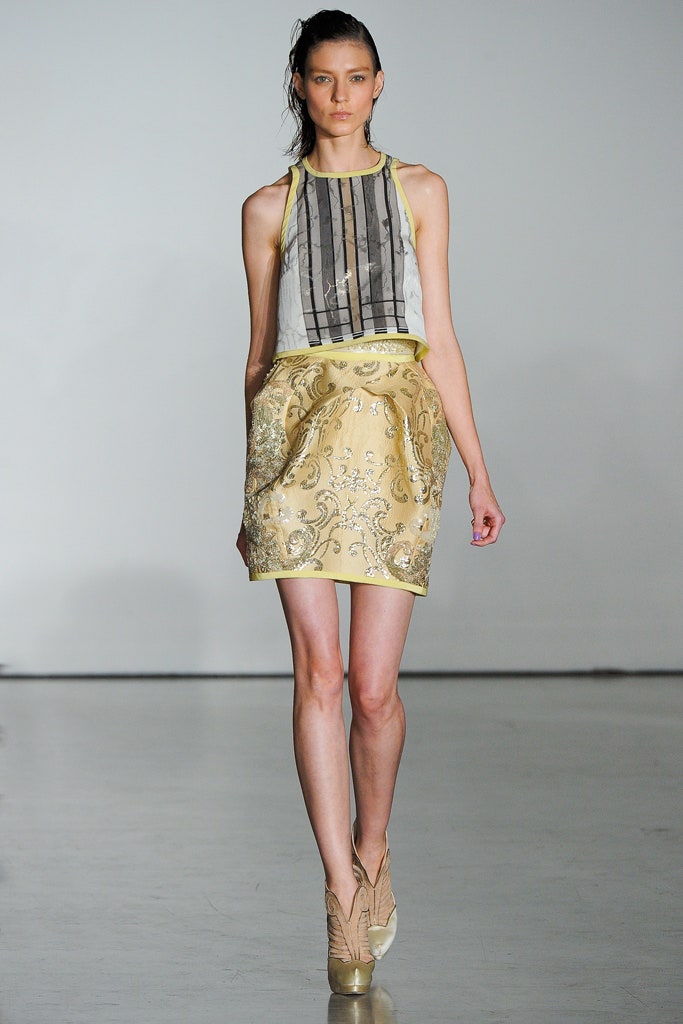 gray silk sleeveless top and yellow embroidered mini skirt