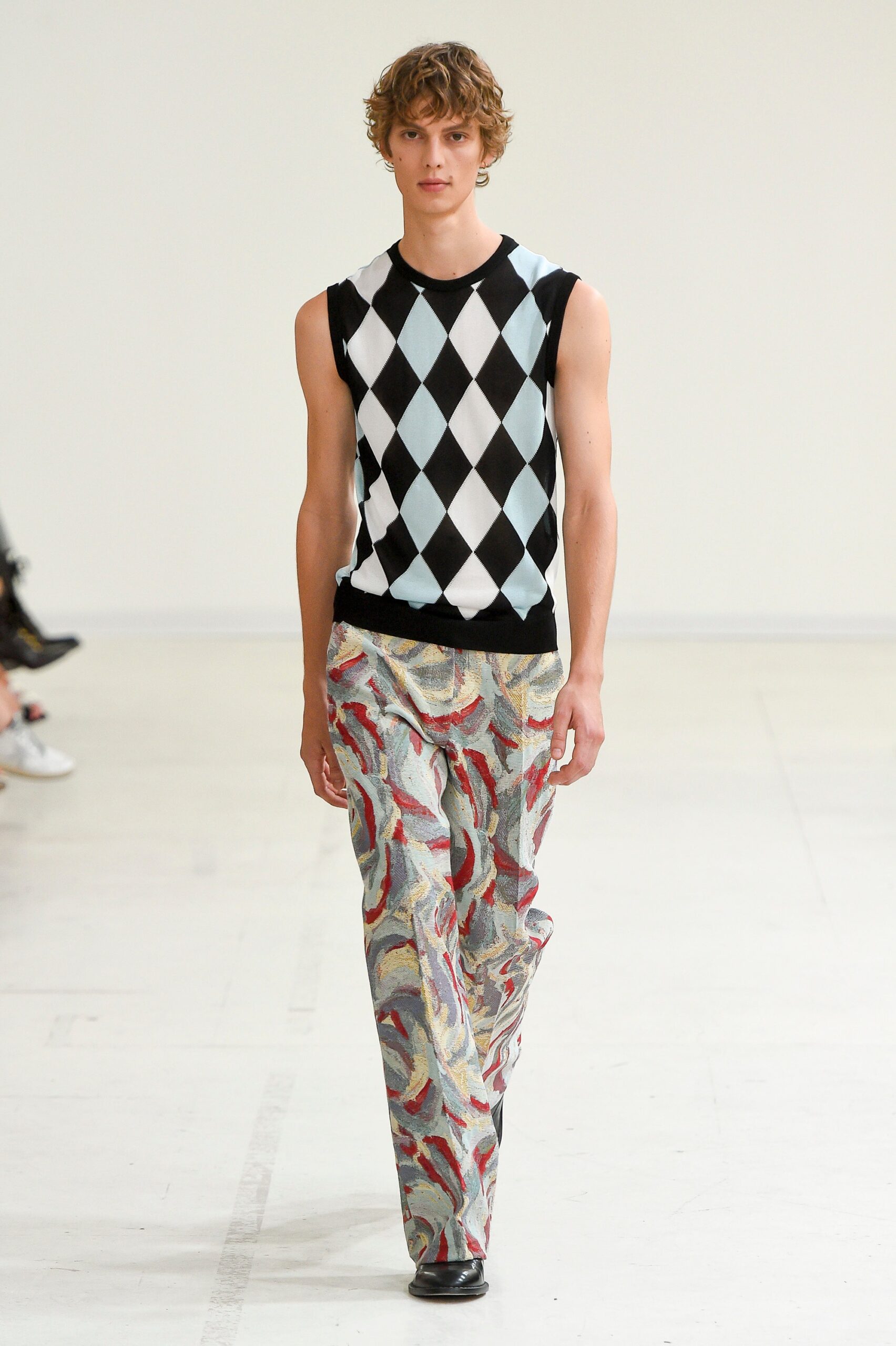 fitted argyle sweater and flared pants