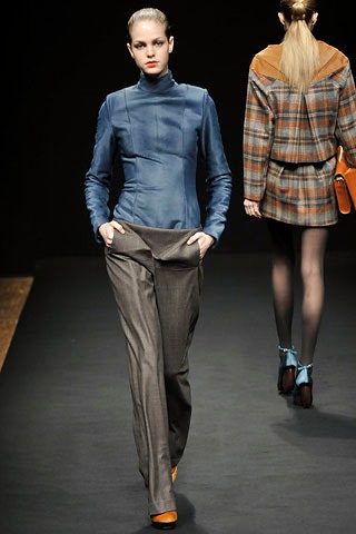 blue silk fitted top and gray tailored pants