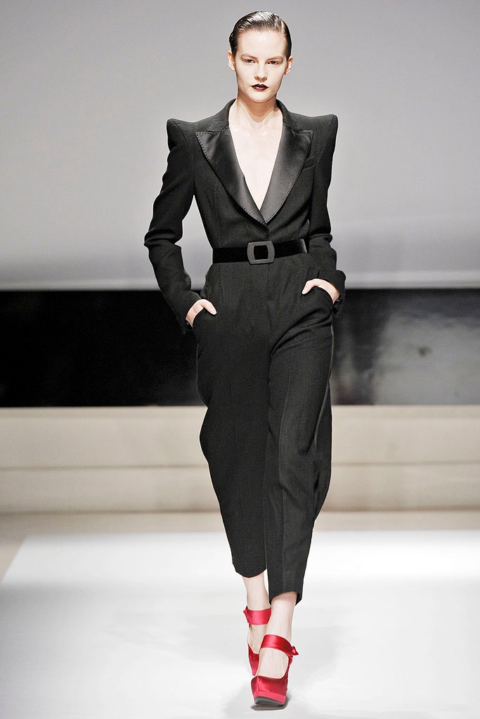 black fitted jumpsuit with red heels