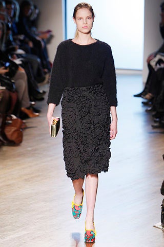 black relaxed wool top with ruffled skirt