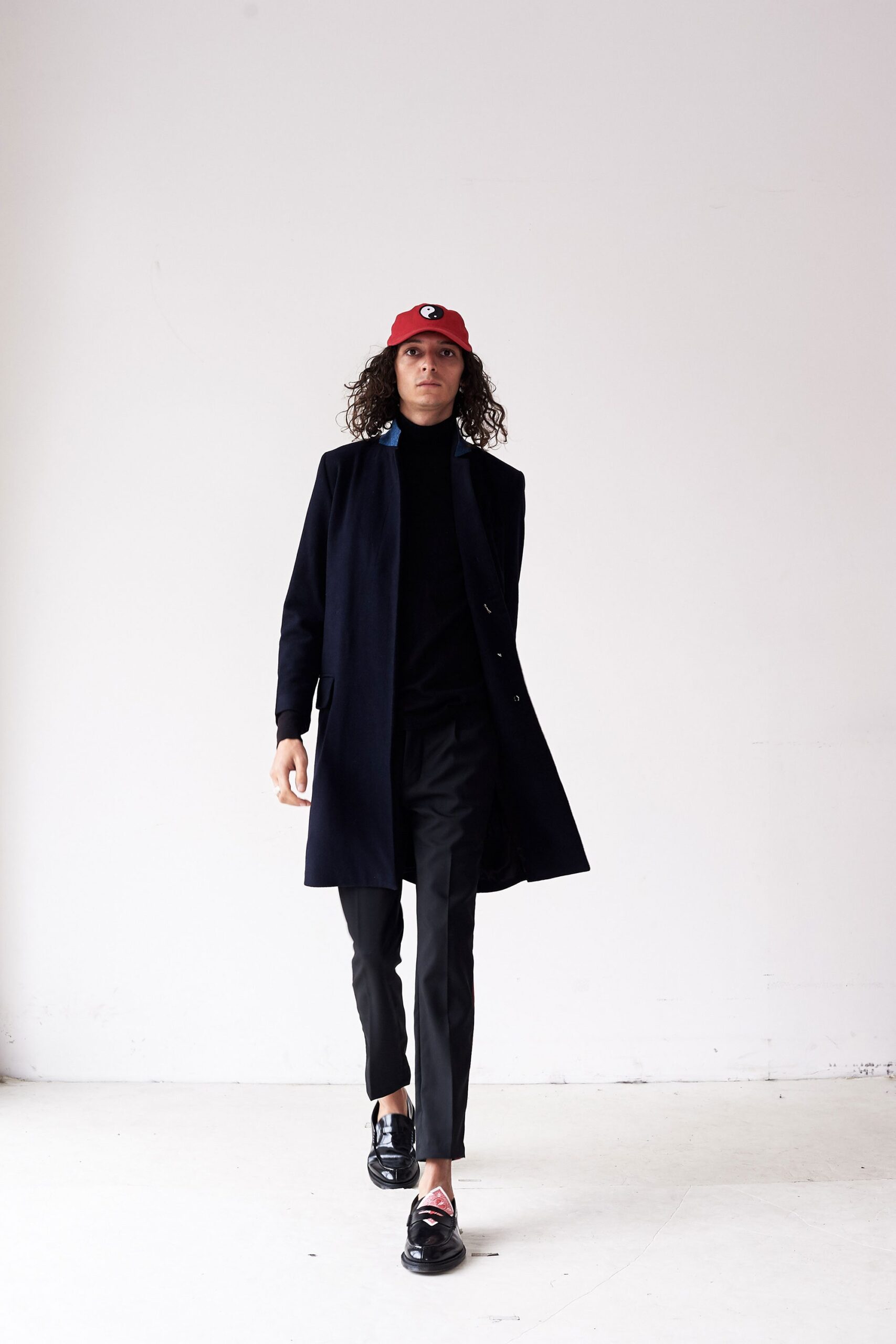 black tailored coat with turtleneck