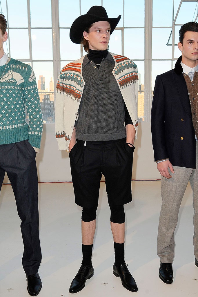 gray sweater with white cardigan and black shorts