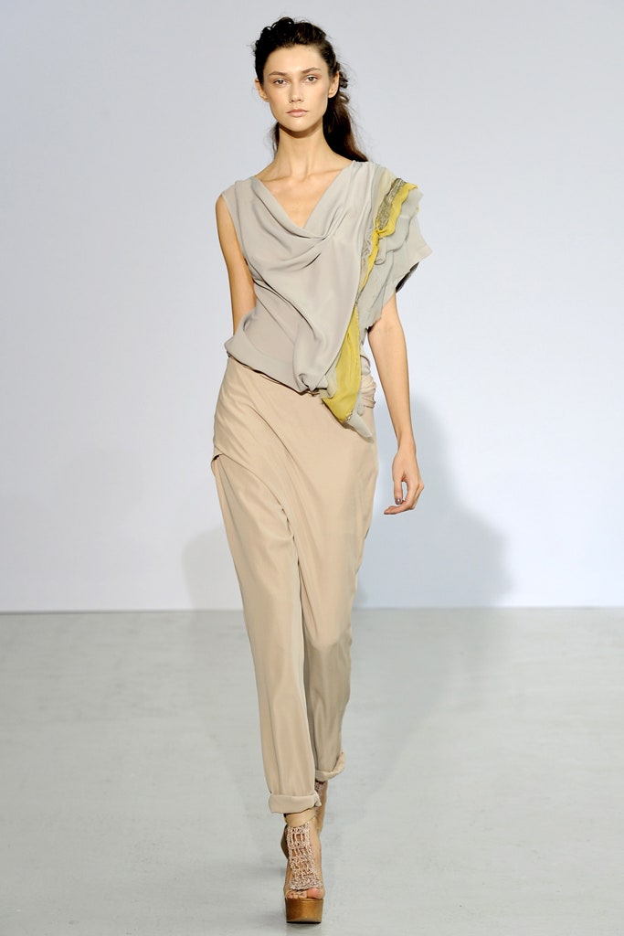 gray silk draped top with beige pants