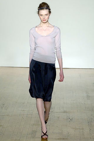 white silk fitted top and black skirt