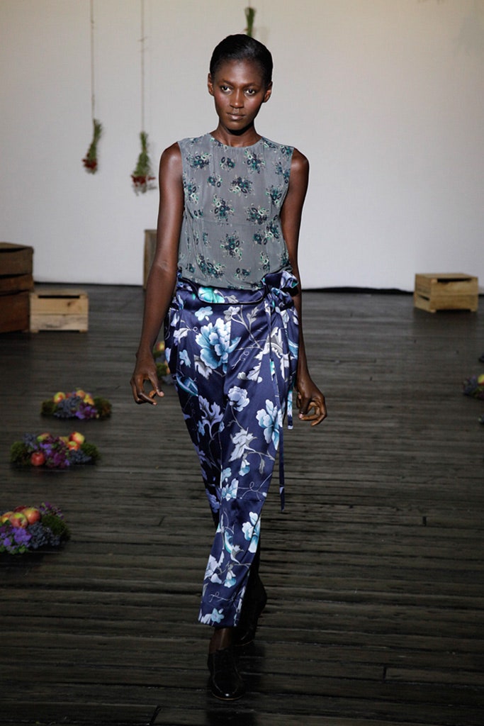 gray sleeveless top with blue pants