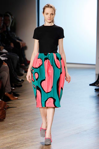 black fitted top with pleated midi skirt