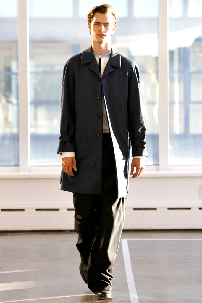 blue relaxed coat with black pants