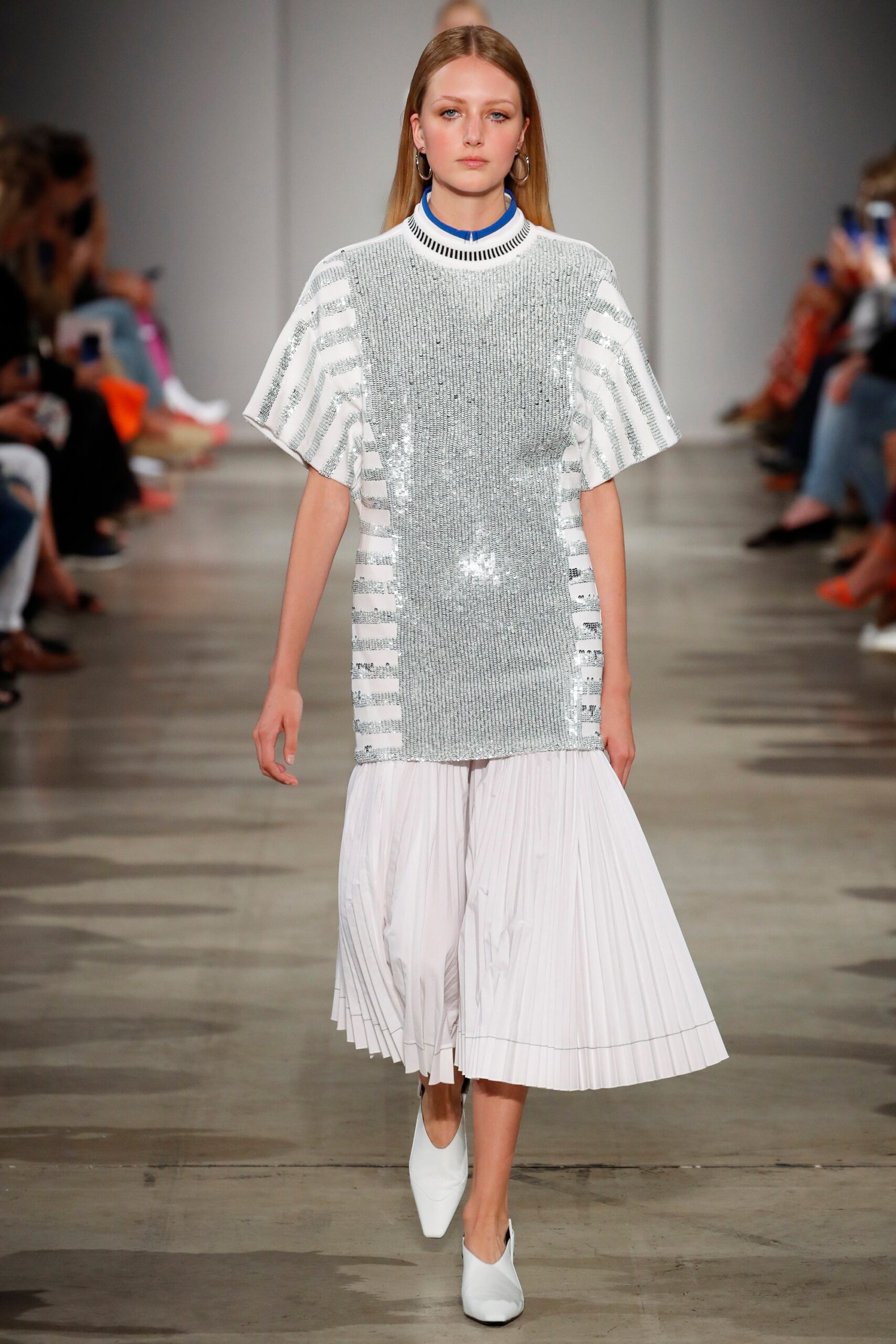 silver sequined top with white pleated skirt
