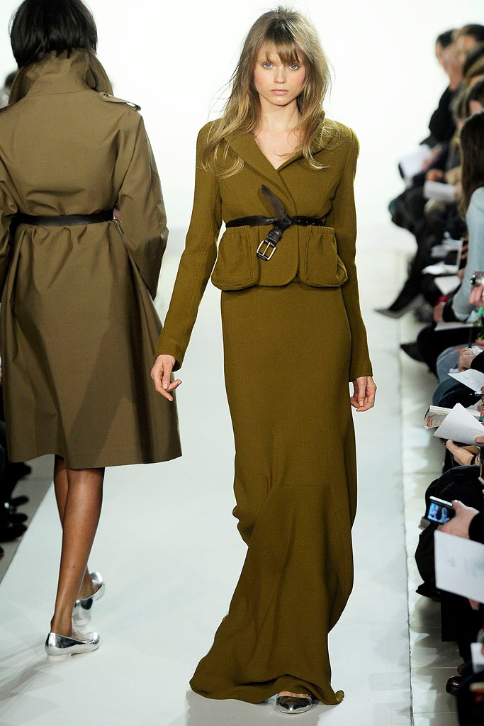 green fitted gown and brown trench