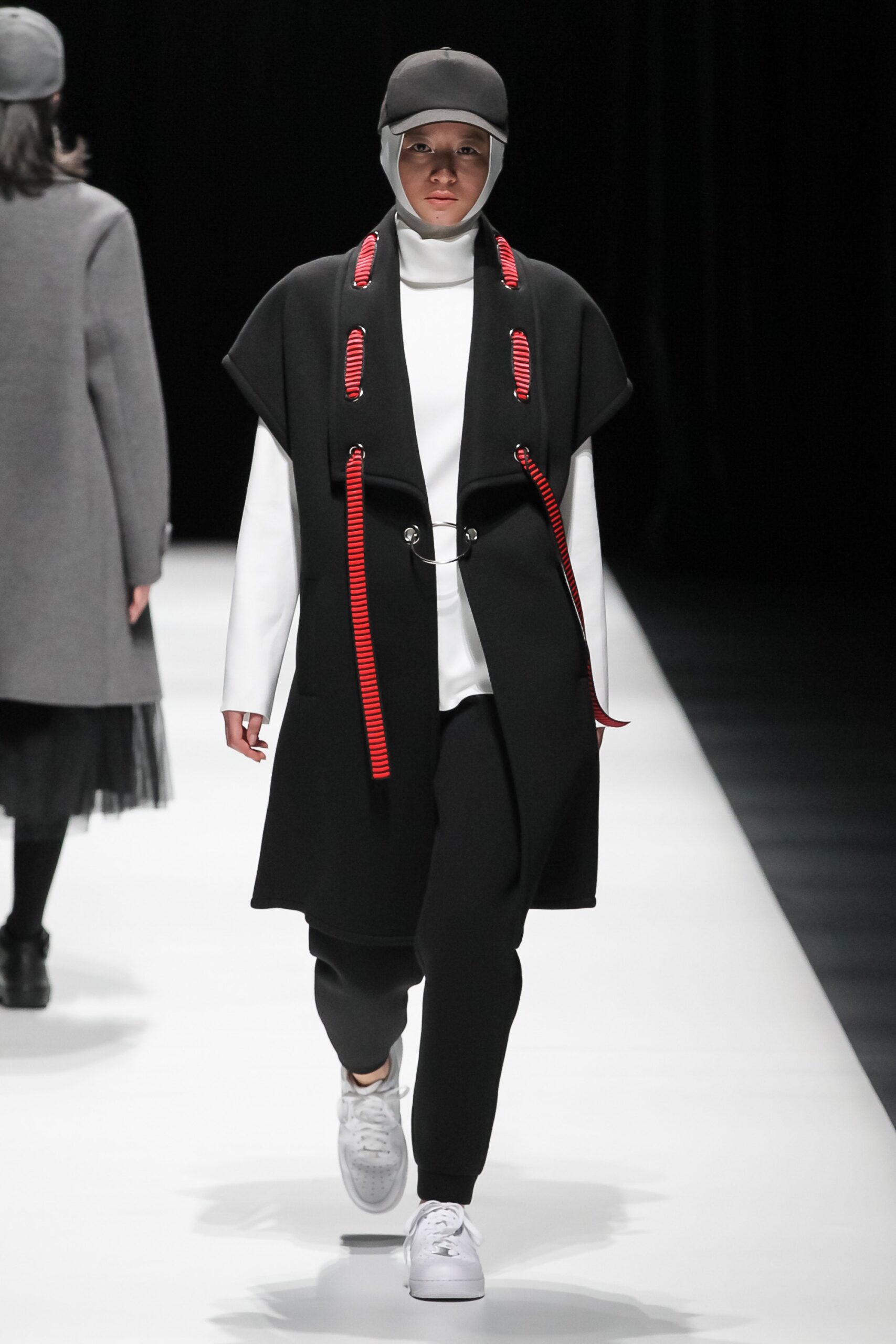 black wool coat with white top