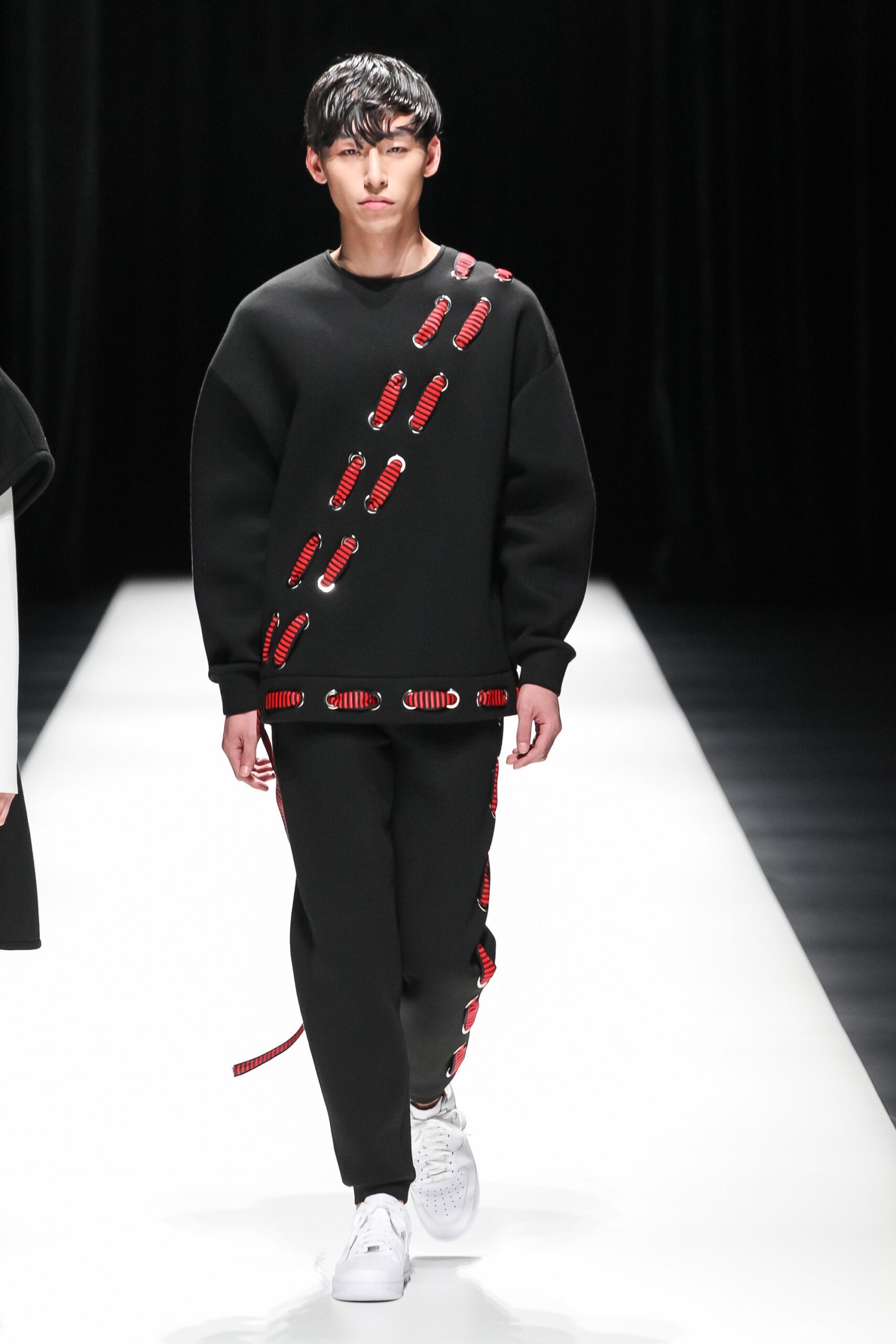black relaxed sweater and slim pants