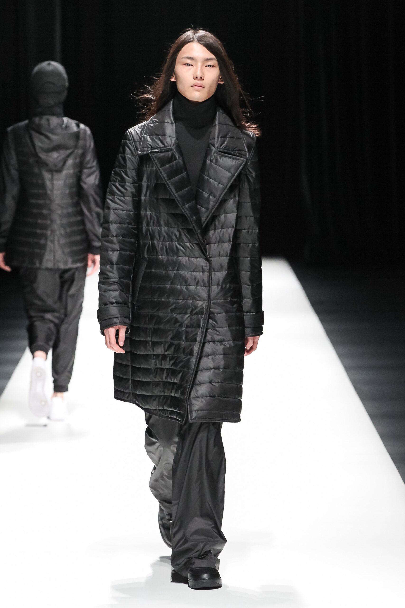 black quilted coat with relaxed pants