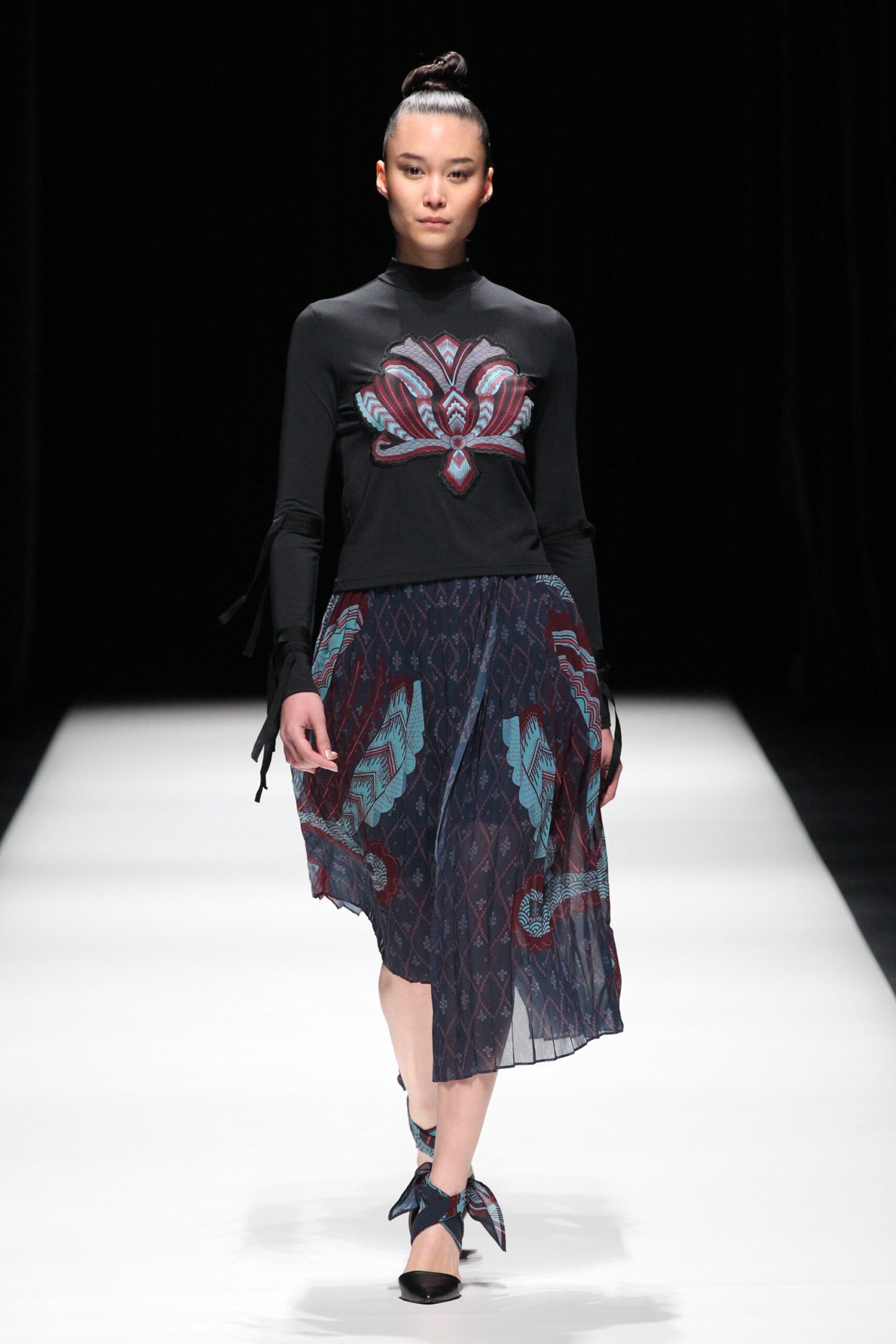 black fitted top with embroidered skirt