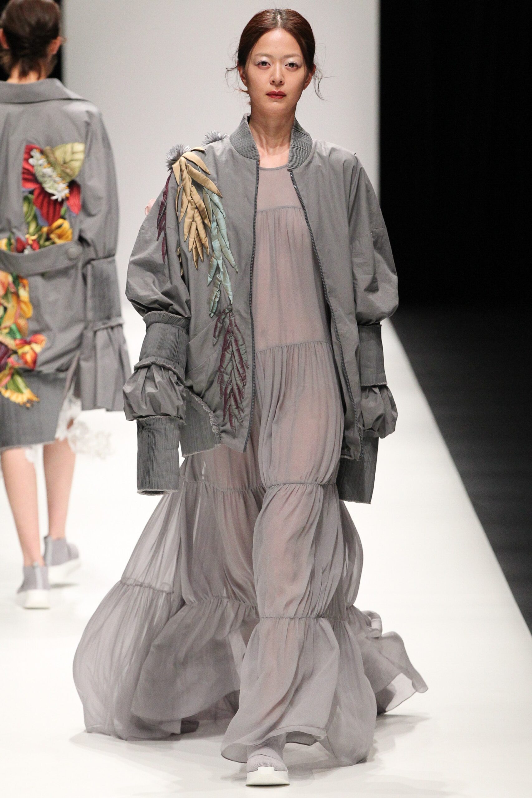 gray embroidered jacket and flowing dress