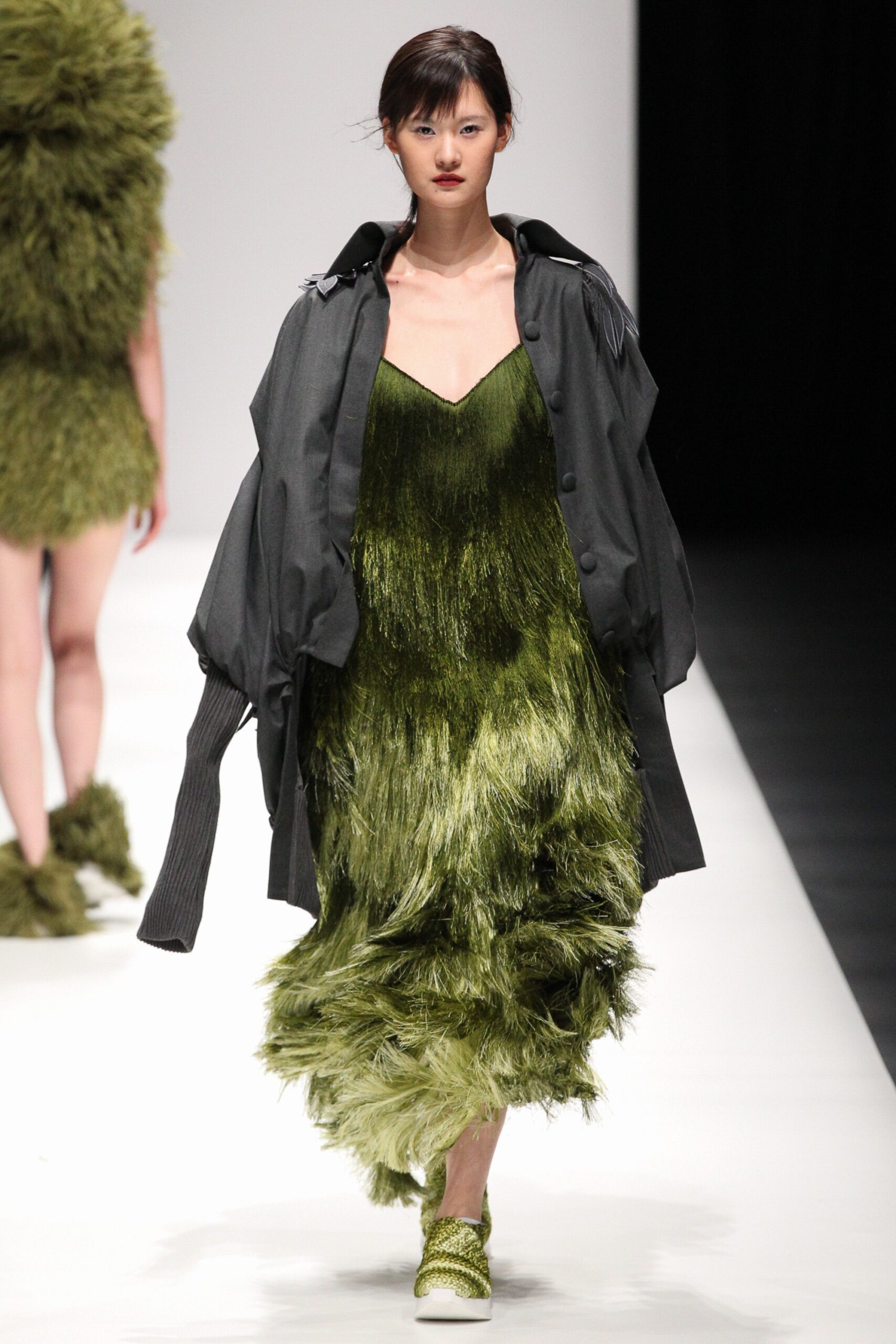 green fringed midi dress with oversized coat