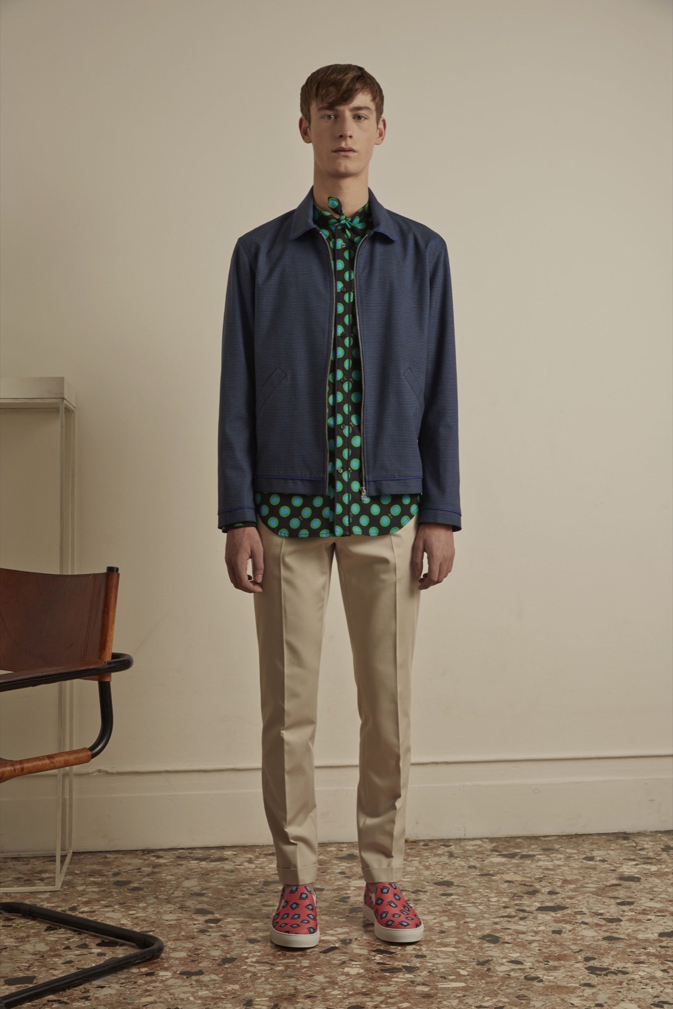 blue jacket green printed shirt beige pants