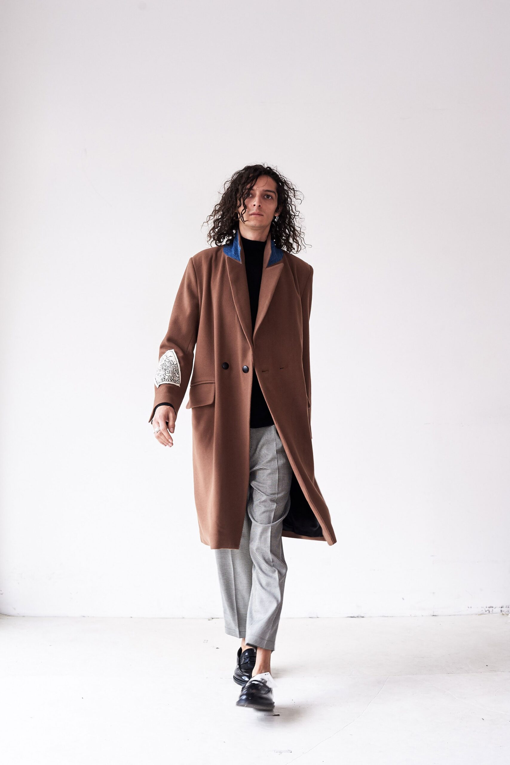 brown wool coat with gray pants