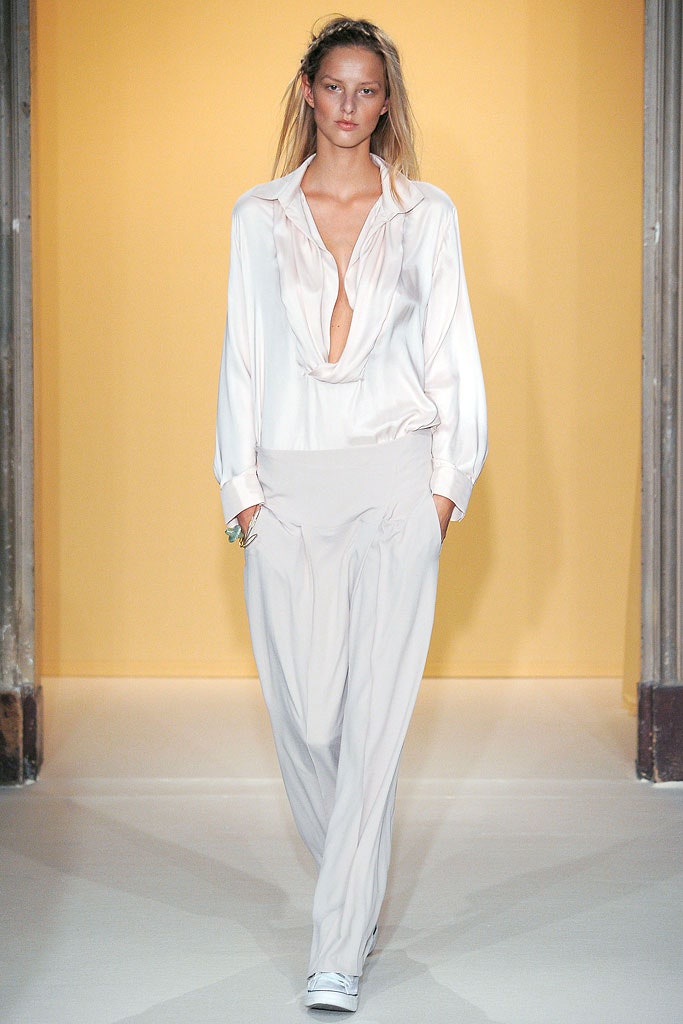 white silk blouse and beige pants