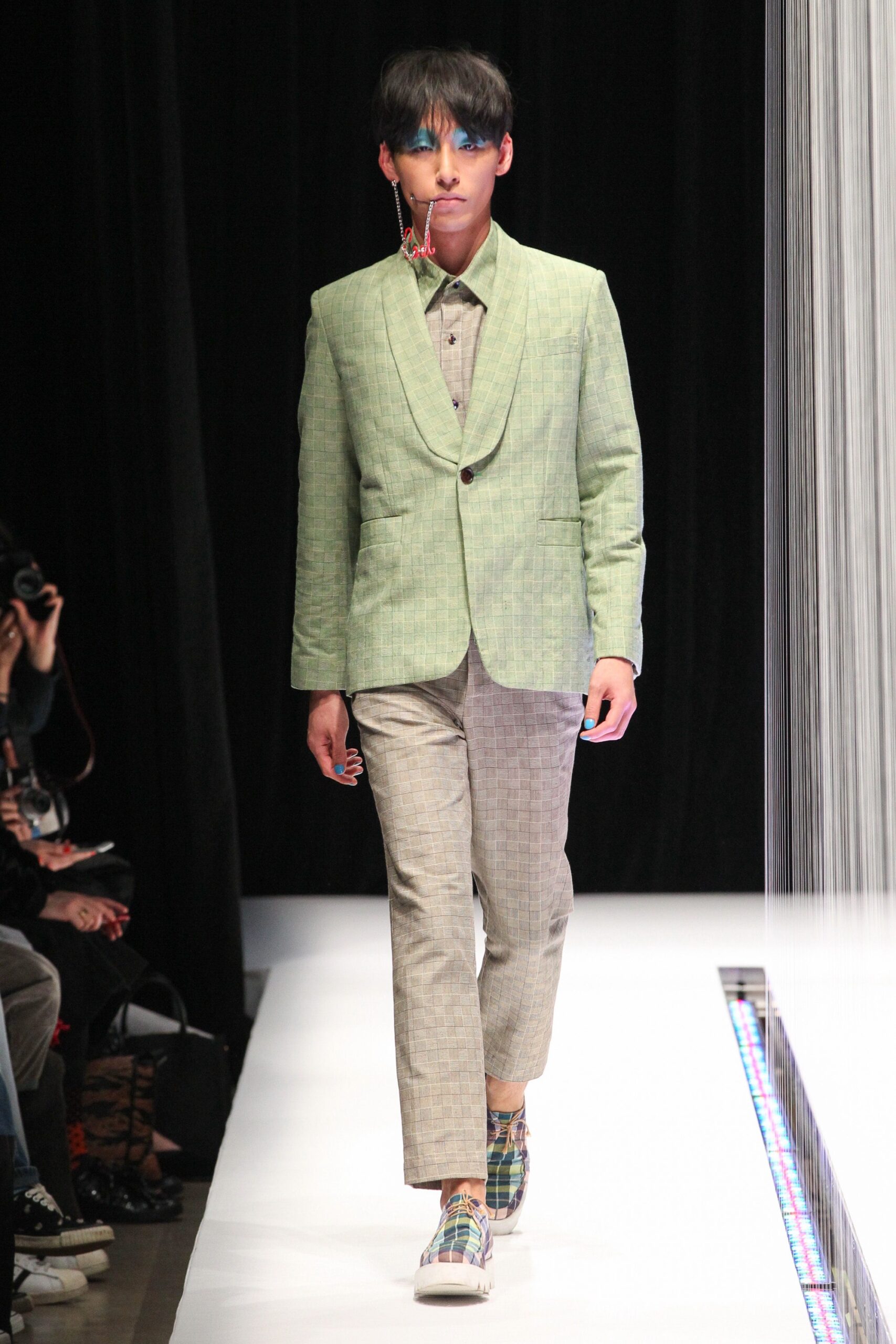 green tailored blazer with checked pants