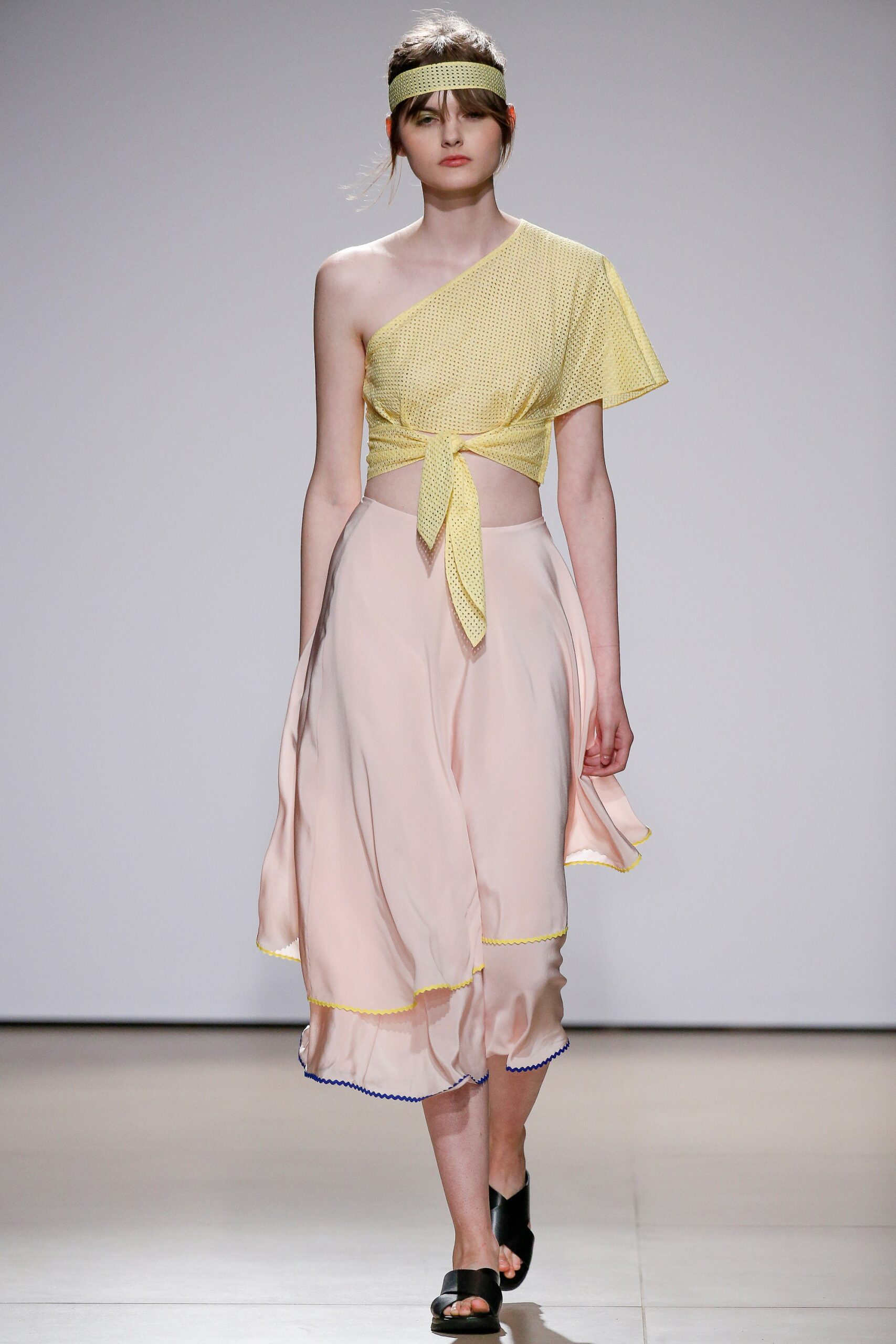 yellow silk off-shoulder top and pink midi skirt