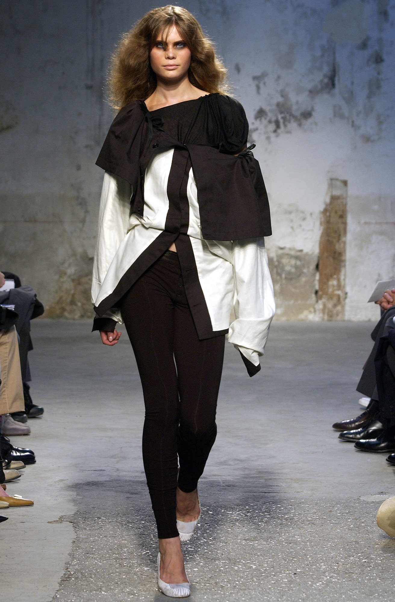 layered black and white top with fitted pants