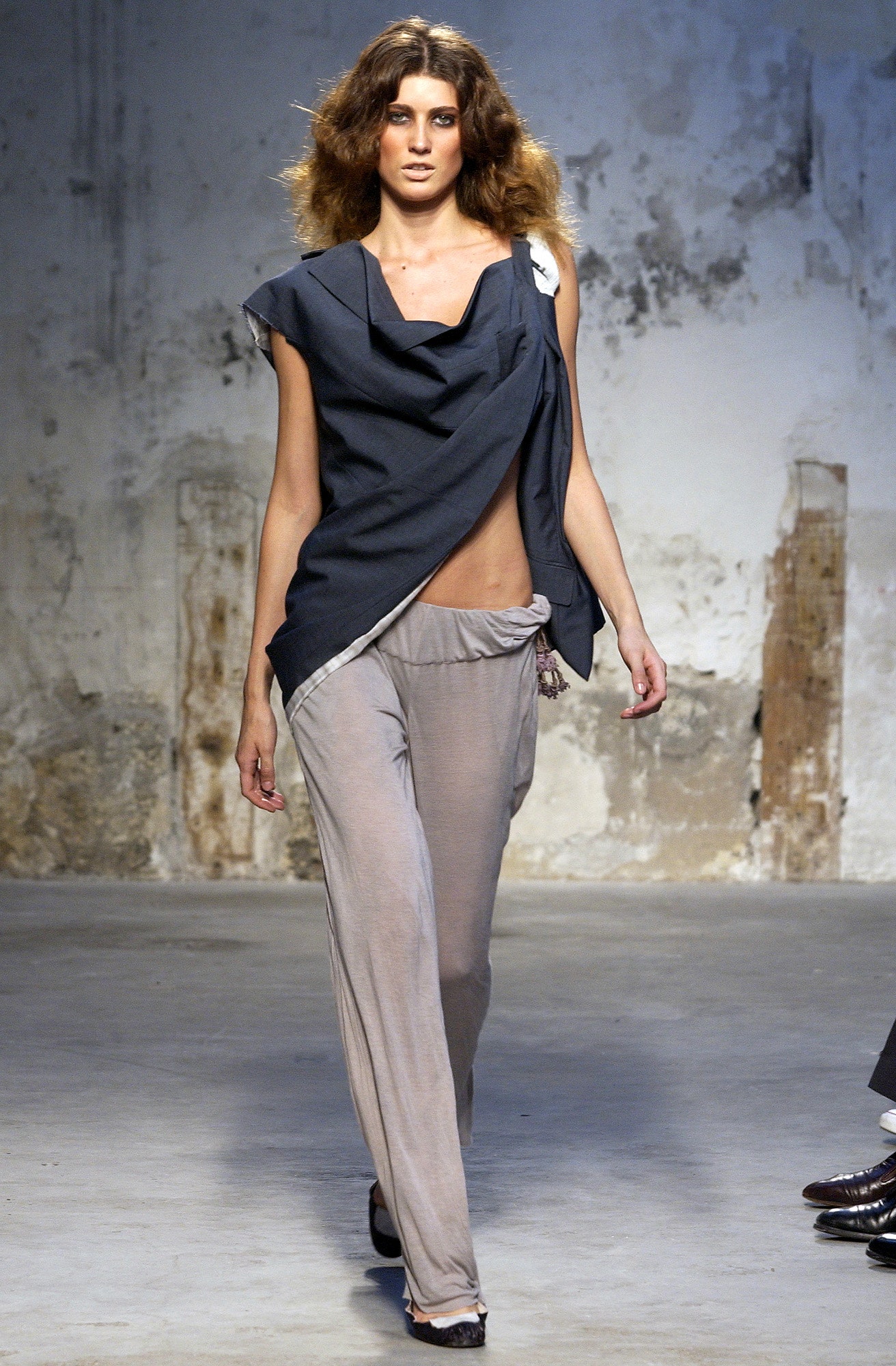 blue draped top with gray pants