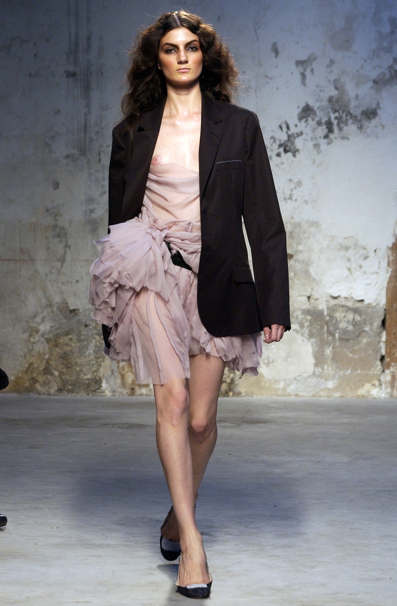 black blazer with pink ruffled dress