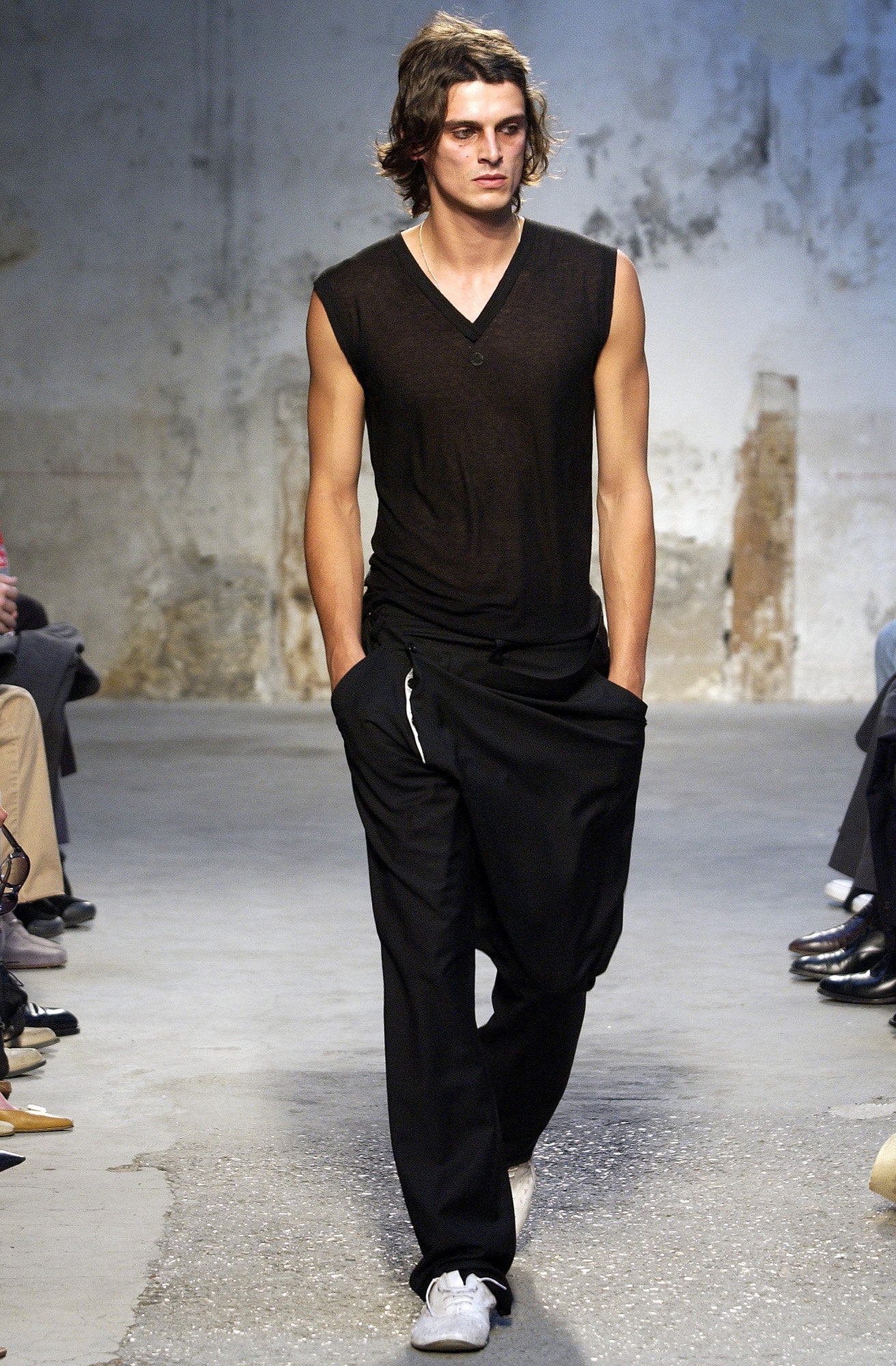 black fitted sleeveless top with relaxed pants