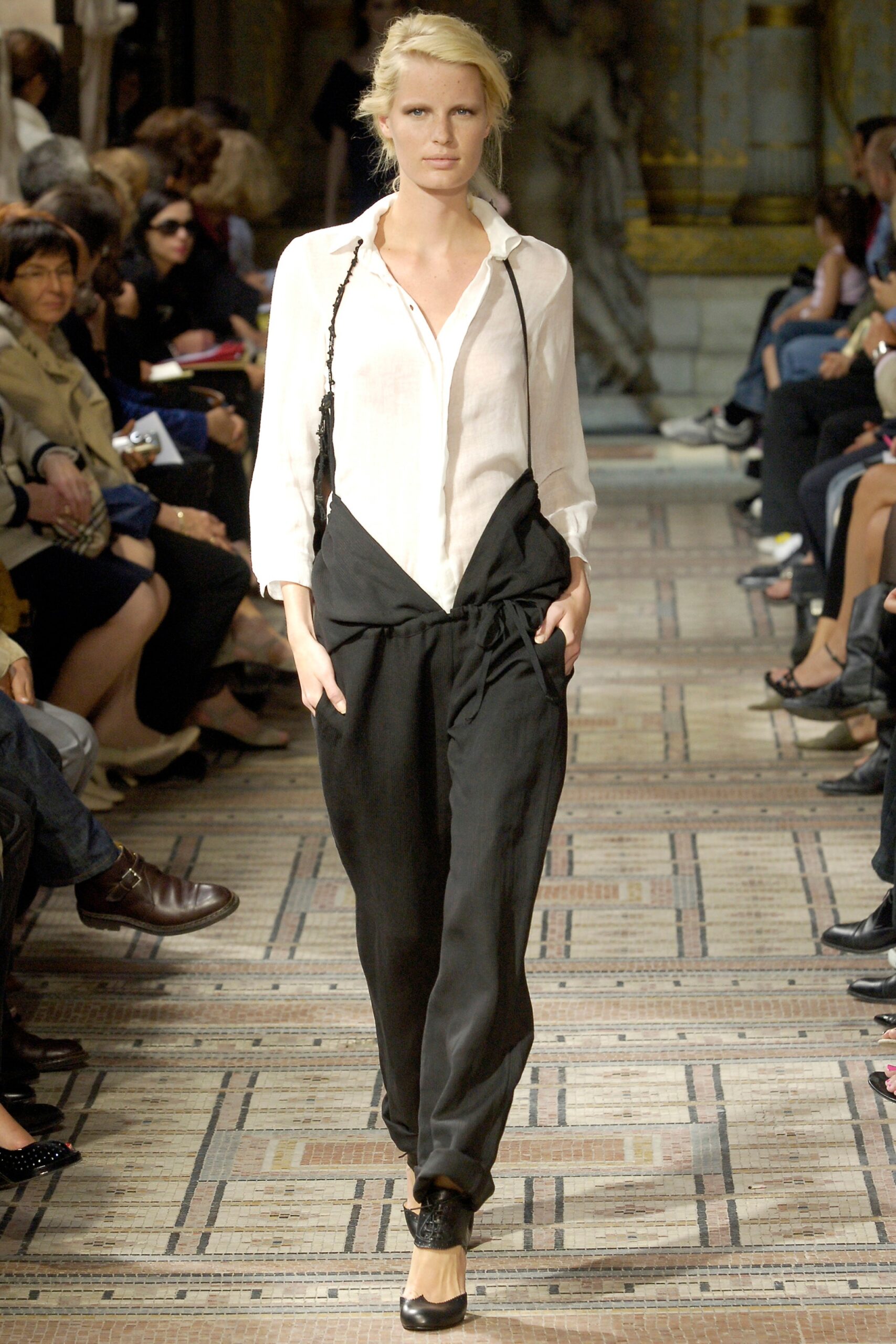 white relaxed shirt with black pants