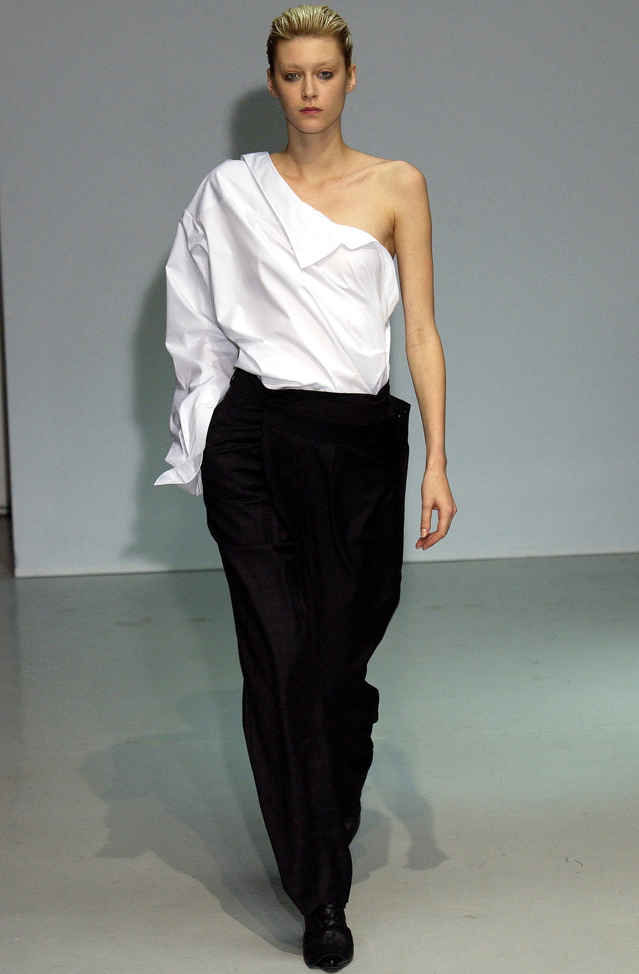 white asymmetric top and black pants